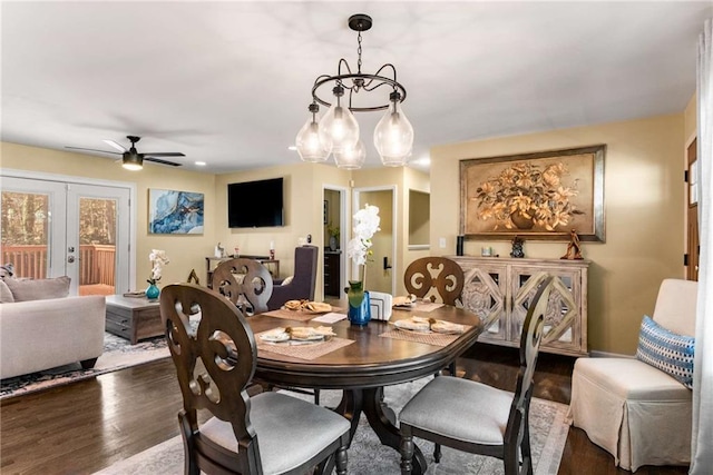 dining area featuring a ceiling fan, wood finished floors, and french doors