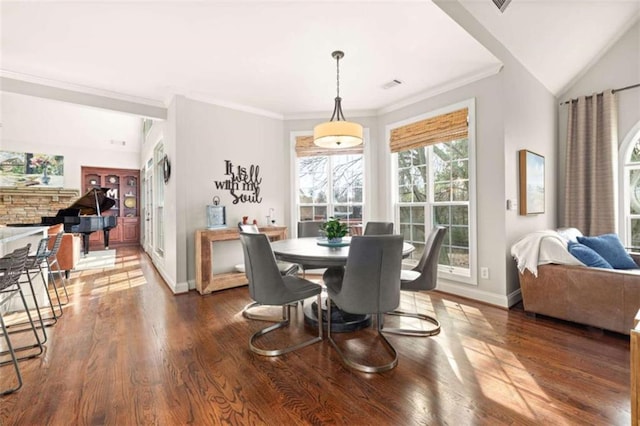 dining room featuring crown molding and dark hardwood / wood-style flooring