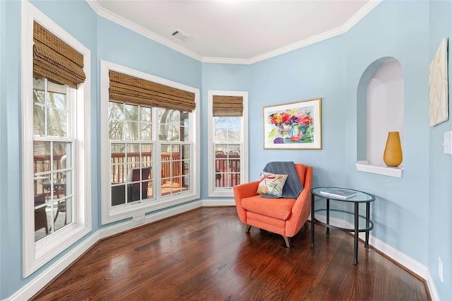 sitting room with crown molding and dark hardwood / wood-style floors