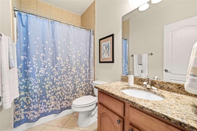 bathroom featuring tile patterned flooring, vanity, toilet, and a shower with shower curtain