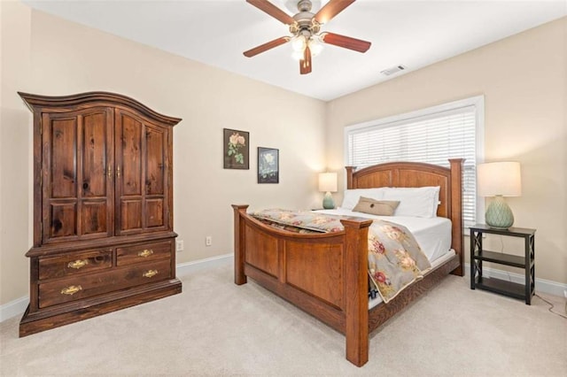 bedroom with light colored carpet and ceiling fan