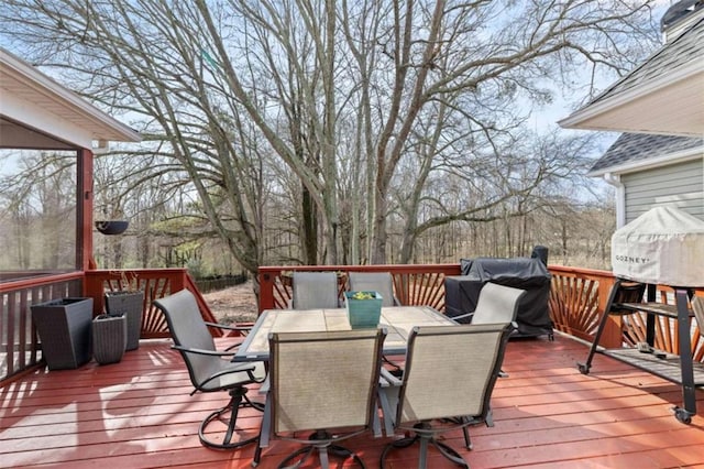 wooden deck with grilling area