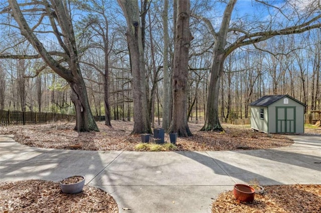 view of patio / terrace with a storage shed