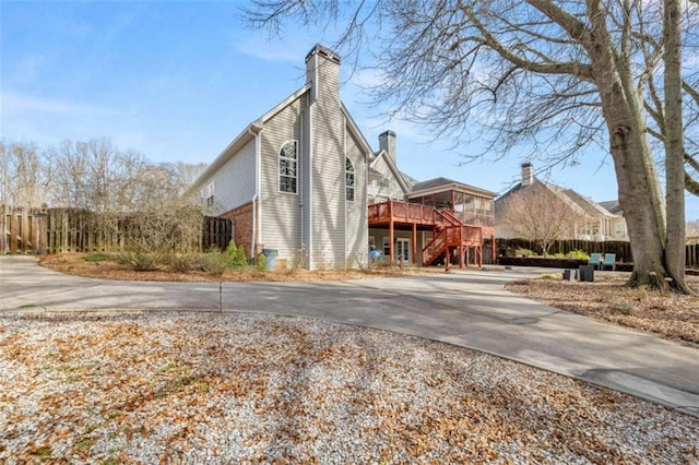 view of side of home featuring a deck