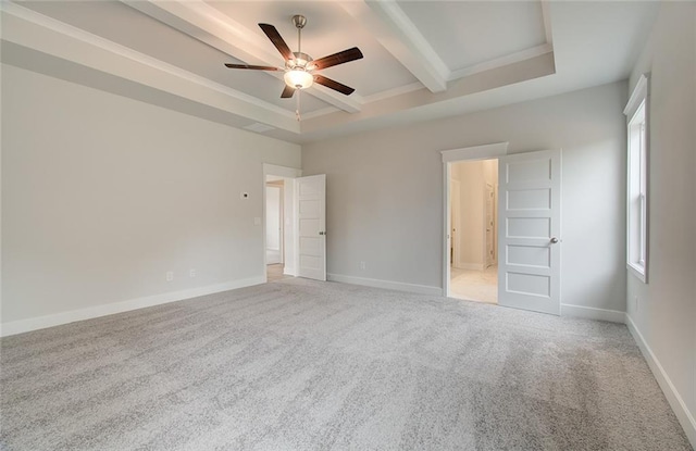 unfurnished bedroom featuring light carpet, a ceiling fan, baseboards, beam ceiling, and a tray ceiling