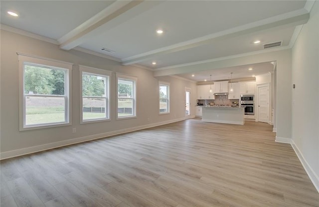 unfurnished living room featuring light wood-style flooring, visible vents, and beamed ceiling