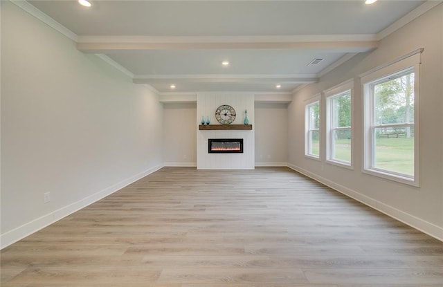 unfurnished living room with a large fireplace, light wood-style flooring, and baseboards