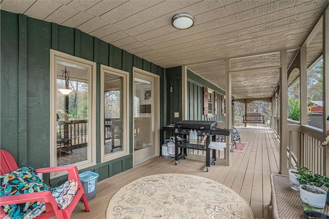 wooden terrace with area for grilling