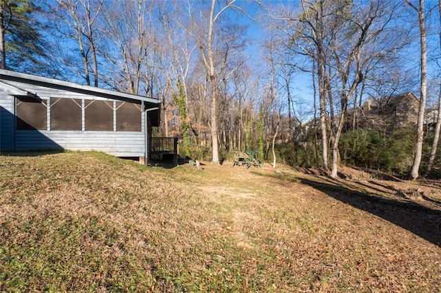 view of yard with a sunroom