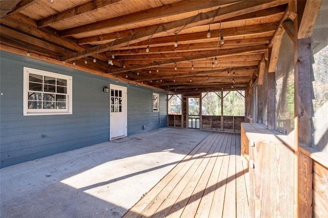 wooden deck with a carport