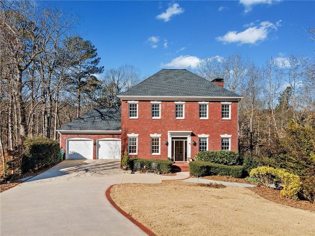 colonial home with a garage