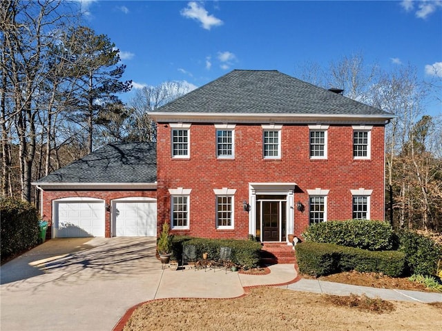 colonial home with a garage