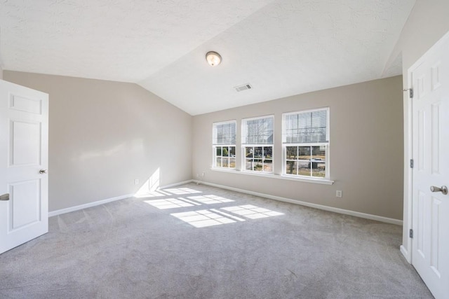 2873 Snapfinger Mnr, Decatur, GA 30035 - unfurnished bedroom with lofted ceiling, carpet floors, and a textured ceiling
