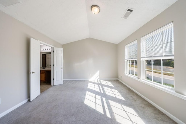 2873 Snapfinger Mnr, Decatur, GA 30035 - empty room featuring light carpet and vaulted ceiling