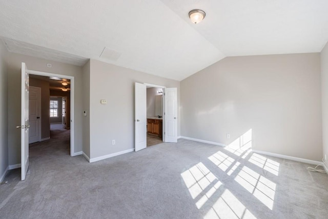 2873 Snapfinger Mnr, Decatur, GA 30035 - unfurnished bedroom with light colored carpet, lofted ceiling, and ensuite bath