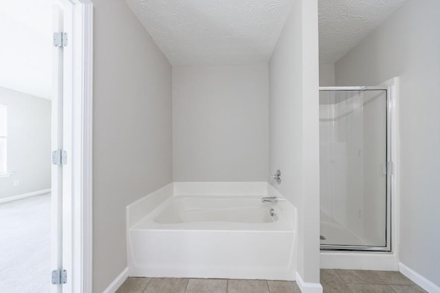 2873 Snapfinger Mnr, Decatur, GA 30035 - full bath featuring a shower stall, a bath, tile patterned floors, and a textured ceiling