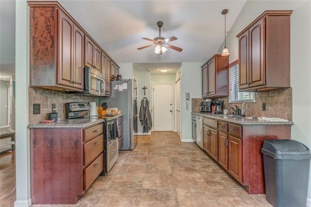 200 Wildwood Cir SE, Calhoun, GA 30701 - kitchen featuring stainless steel appliances, ceiling fan, decorative backsplash, baseboards, and decorative light fixtures