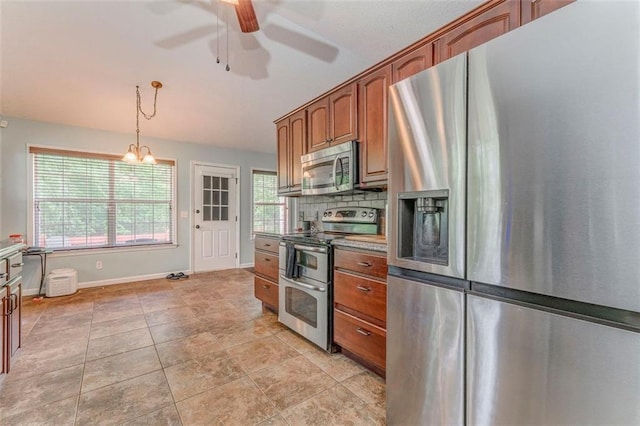 200 Wildwood Cir SE, Calhoun, GA 30701 - kitchen with appliances with stainless steel finishes, ceiling fan, brown cabinetry, and baseboards