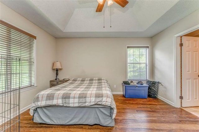 200 Wildwood Cir SE, Calhoun, GA 30701 - bedroom with a tray ceiling, wood finished floors, baseboards, and a textured ceiling