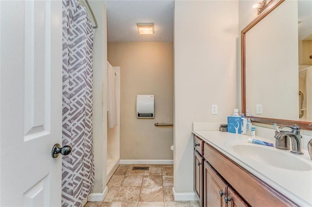200 Wildwood Cir SE, Calhoun, GA 30701 - bathroom with vanity, a textured ceiling, a shower with shower curtain, baseboards, and toilet