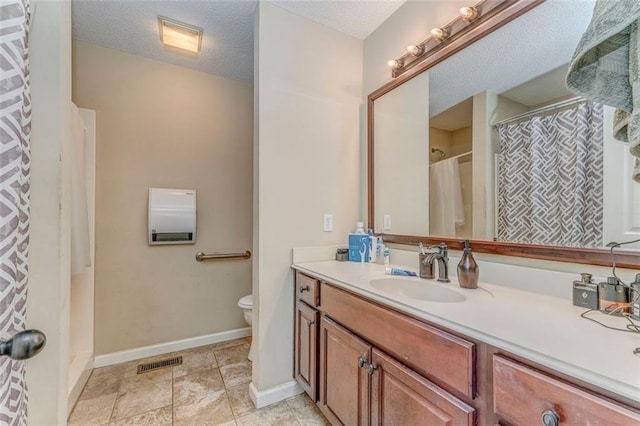 200 Wildwood Cir SE, Calhoun, GA 30701 - bathroom featuring vanity, toilet, a textured ceiling, and baseboards