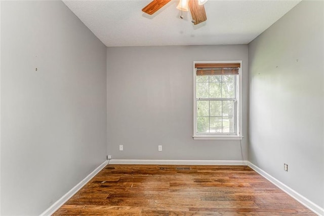 200 Wildwood Cir SE, Calhoun, GA 30701 - unfurnished room with ceiling fan, wood finished floors, and baseboards