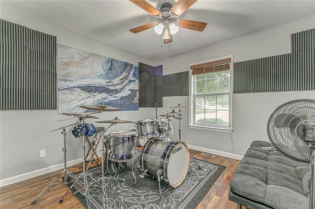 200 Wildwood Cir SE, Calhoun, GA 30701 - rec room featuring wood finished floors, ceiling fan, a textured ceiling, and baseboards