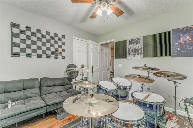 200 Wildwood Cir SE, Calhoun, GA 30701 - living area with a textured ceiling, ceiling fan, and baseboards