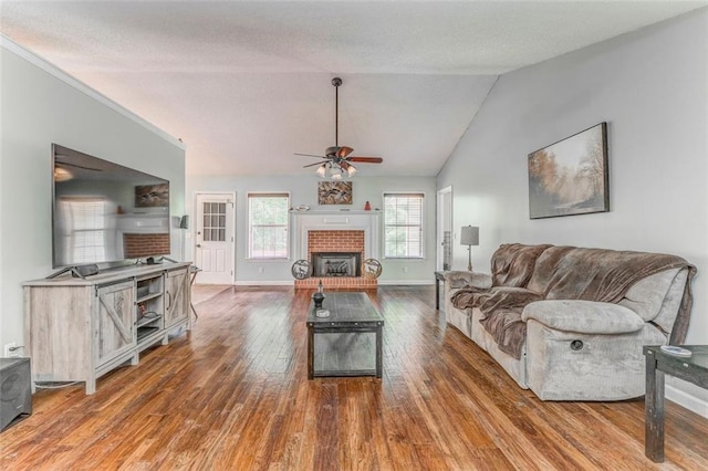 200 Wildwood Cir SE, Calhoun, GA 30701 - living room with wood finished floors, a ceiling fan, a fireplace, baseboards, and lofted ceiling