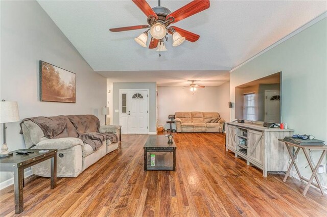 200 Wildwood Cir SE, Calhoun, GA 30701 - living room with ceiling fan, light wood-style floors, lofted ceiling, and baseboards