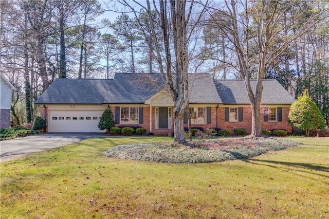 single story home featuring a garage and a front yard