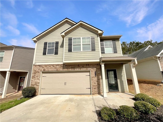 view of front of property with a garage, concrete driveway, and brick siding