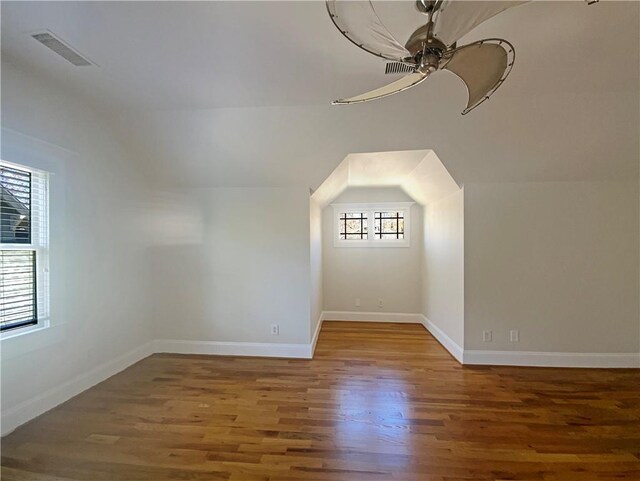 carpeted empty room with ceiling fan and baseboards