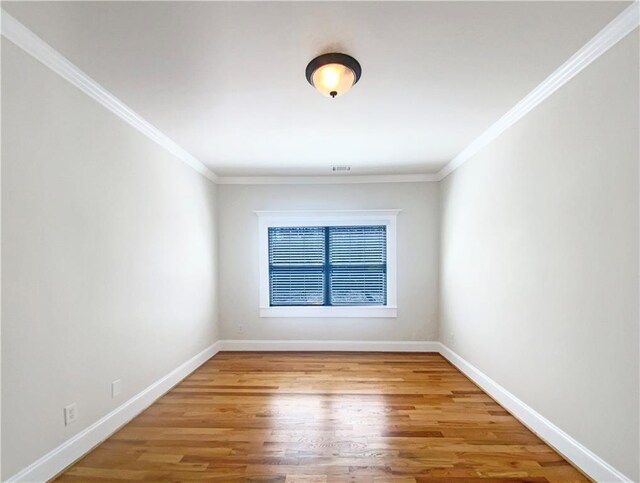 carpeted empty room featuring a ceiling fan, a raised ceiling, and baseboards