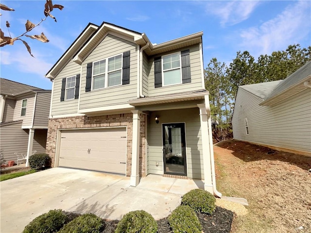 view of front facade with a garage, concrete driveway, and brick siding