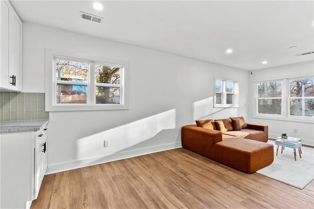 sitting room featuring light hardwood / wood-style floors