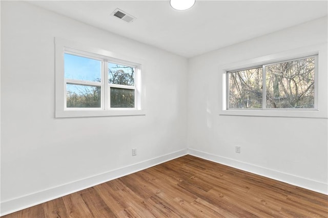 empty room featuring hardwood / wood-style floors