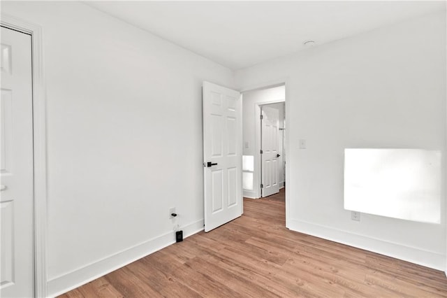 unfurnished bedroom featuring light wood-type flooring