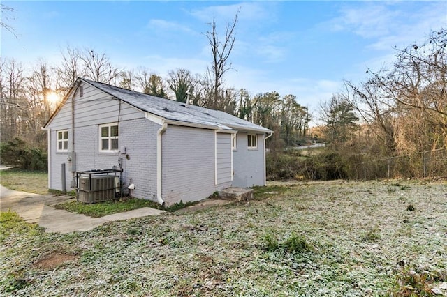 view of home's exterior with central AC unit