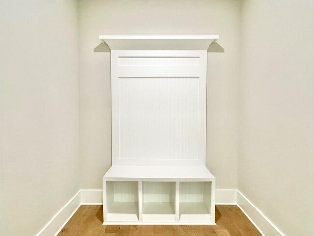 237 Lotus Ln, Covington, GA 30016 - mudroom with baseboards and wood finished floors