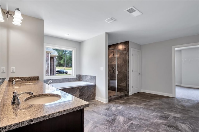 237 Lotus Ln, Covington, GA 30016 - bathroom featuring a stall shower, a garden tub, and double vanity