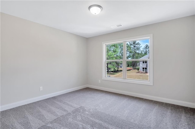 237 Lotus Ln, Covington, GA 30016 - carpeted spare room featuring baseboards