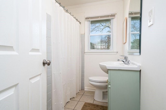 bathroom featuring toilet, curtained shower, tile patterned flooring, crown molding, and vanity