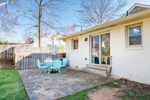 view of patio featuring fence