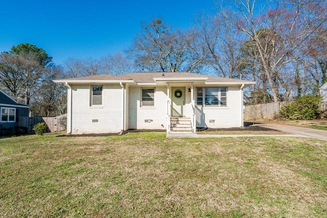 view of front of house with crawl space, fence, a front lawn, and brick siding