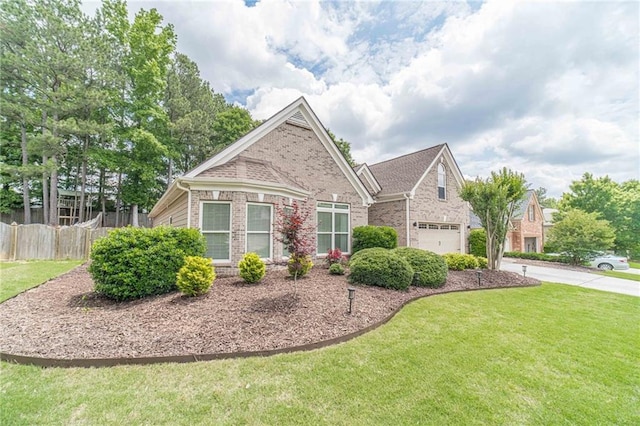 view of front of home featuring brick siding, driveway, and an attached garage
