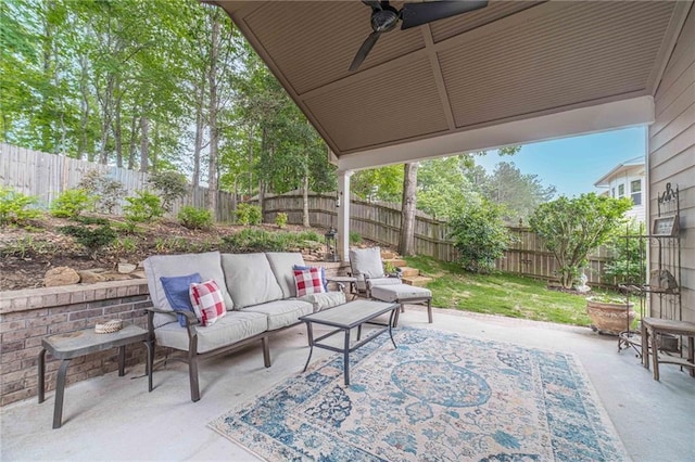 view of patio / terrace featuring an outdoor hangout area, a fenced backyard, and a ceiling fan