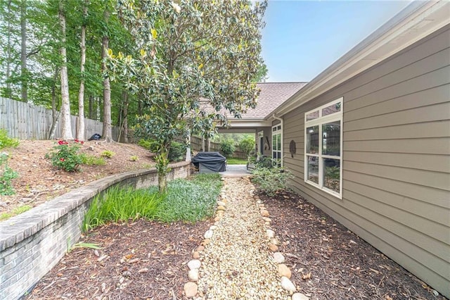 view of yard featuring fence and a patio