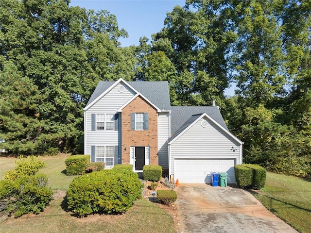 view of front of home with a garage and a front yard