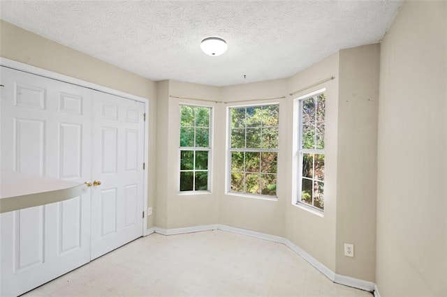 empty room with a textured ceiling